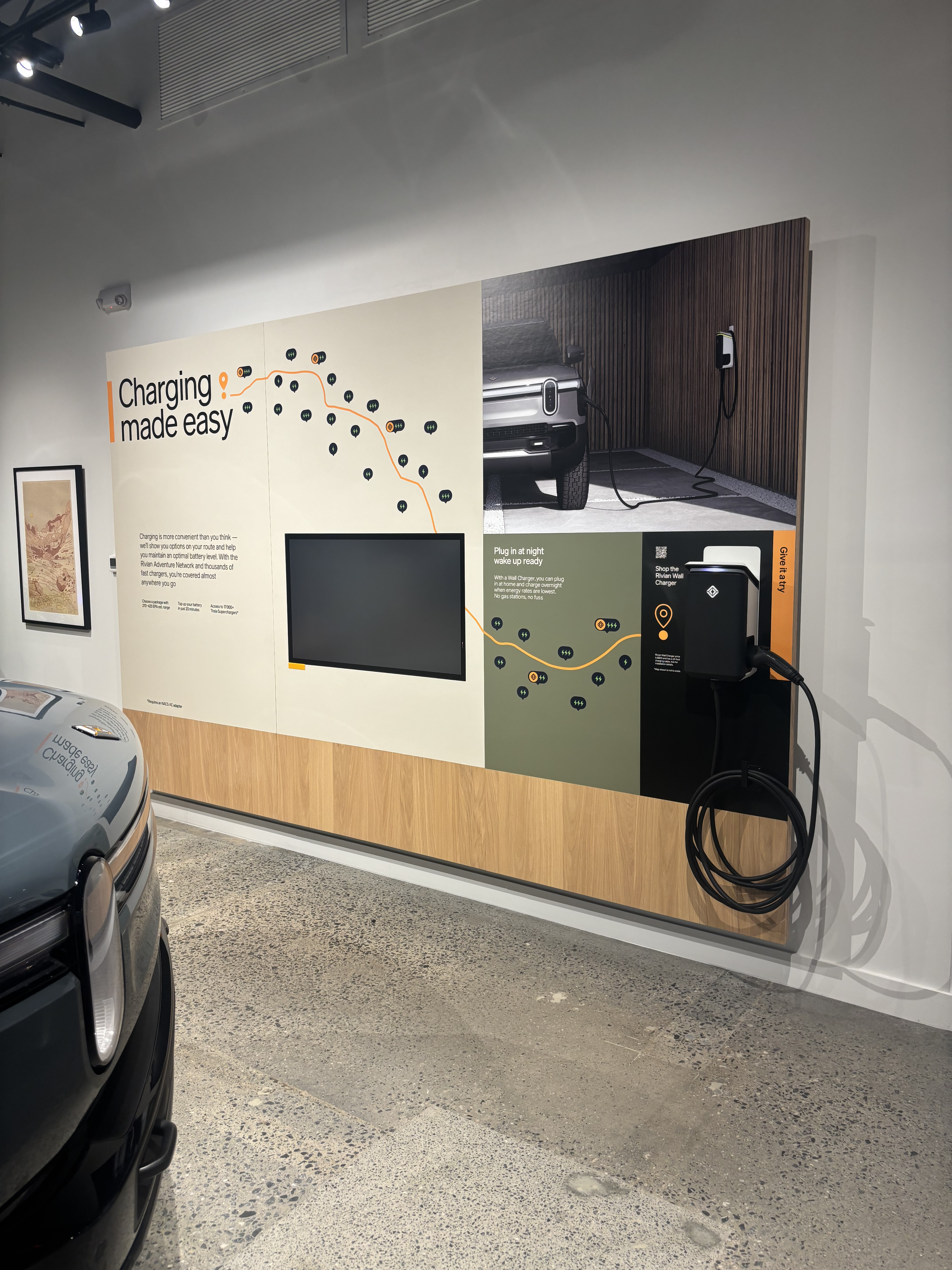 Dealership showroom with electric vehicles and charging stations